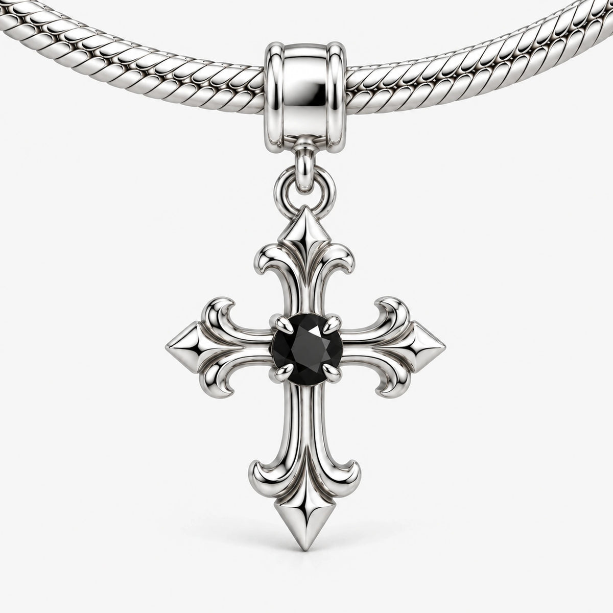 Midnight Fleur Cross Charm in silver on a snake chain charm bracelet