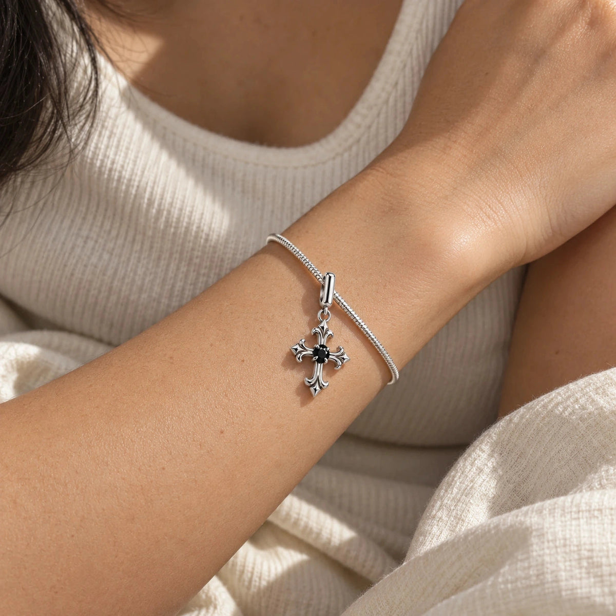 Midnight Fleur Cross Charm in silver, worn
