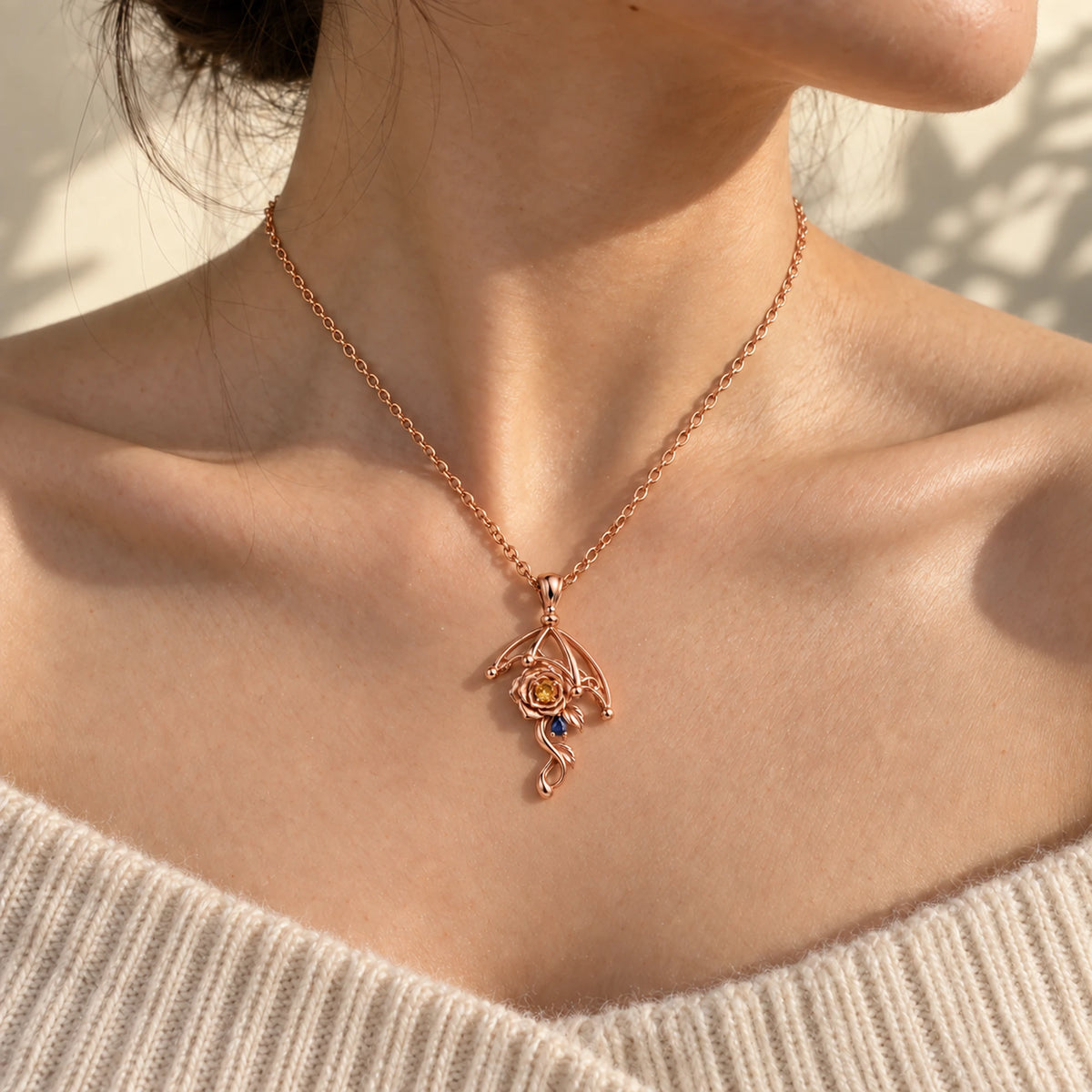 Navia Necklace in rose gold, worn on a model