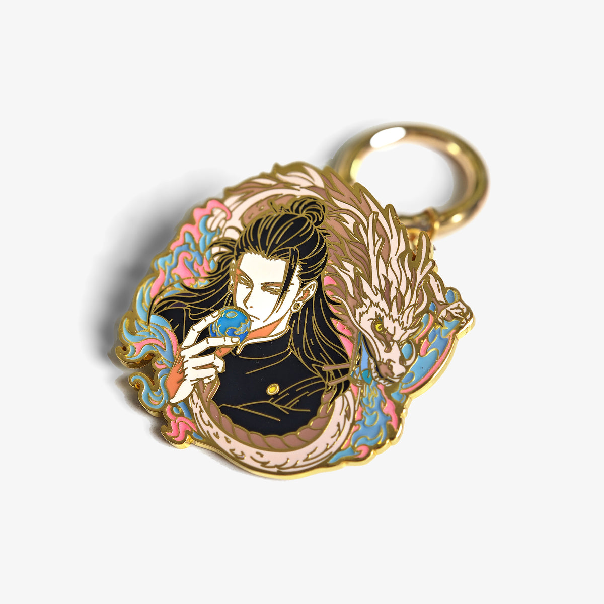 Gold pin keychain converter holding an enamel pin, with a spring-gate keyring