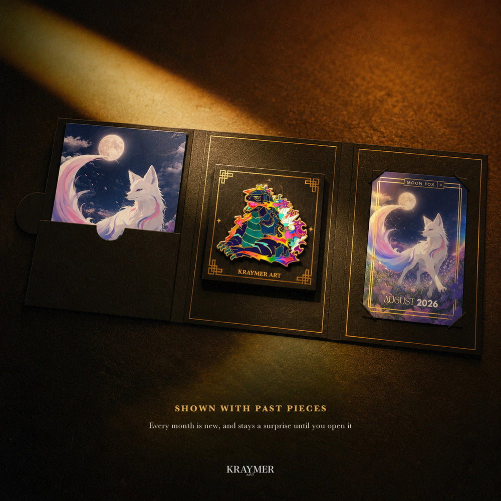 The folio open with past pieces: an enamel pin on its card, an art print and an art card