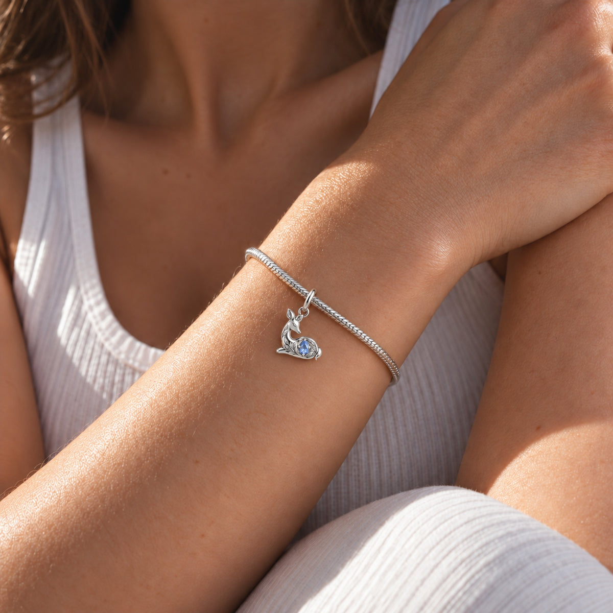 Resting Doe Pear Charm in silver, worn