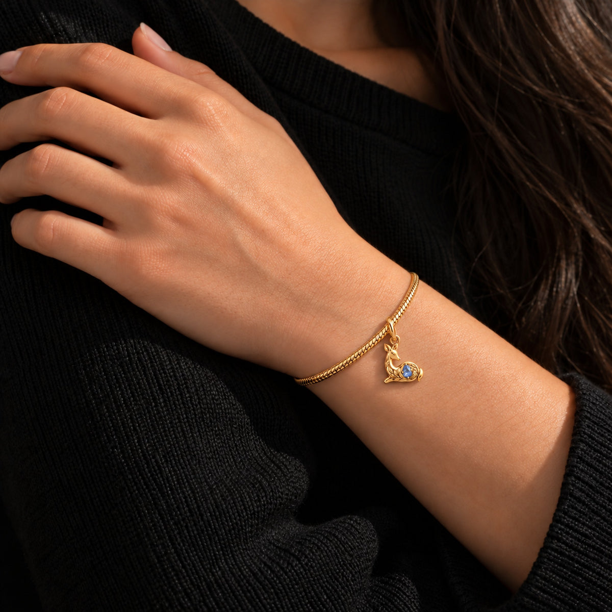 Resting Doe Pear Charm in gold, worn