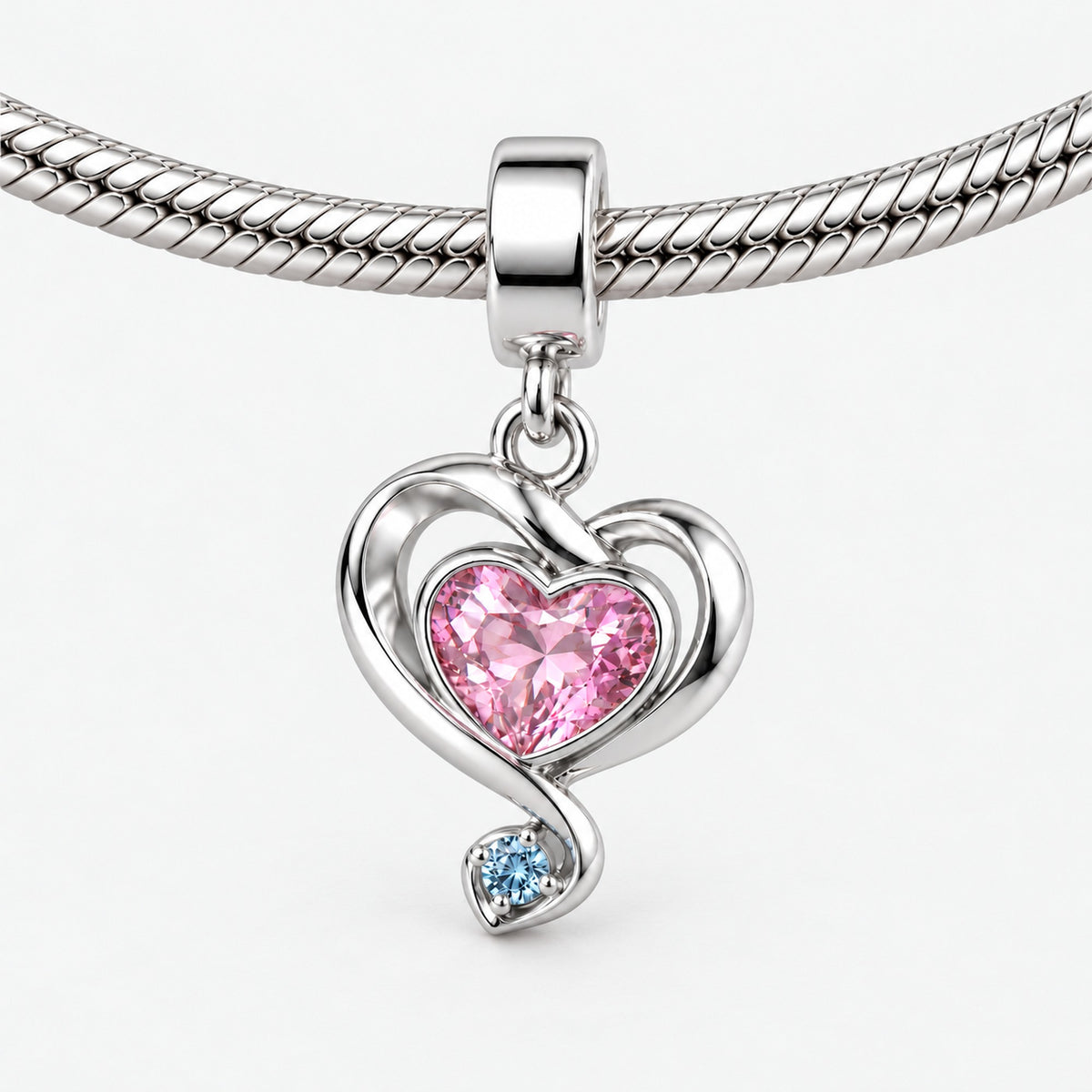 Ribbon Path Charm in silver, on a charm bracelet