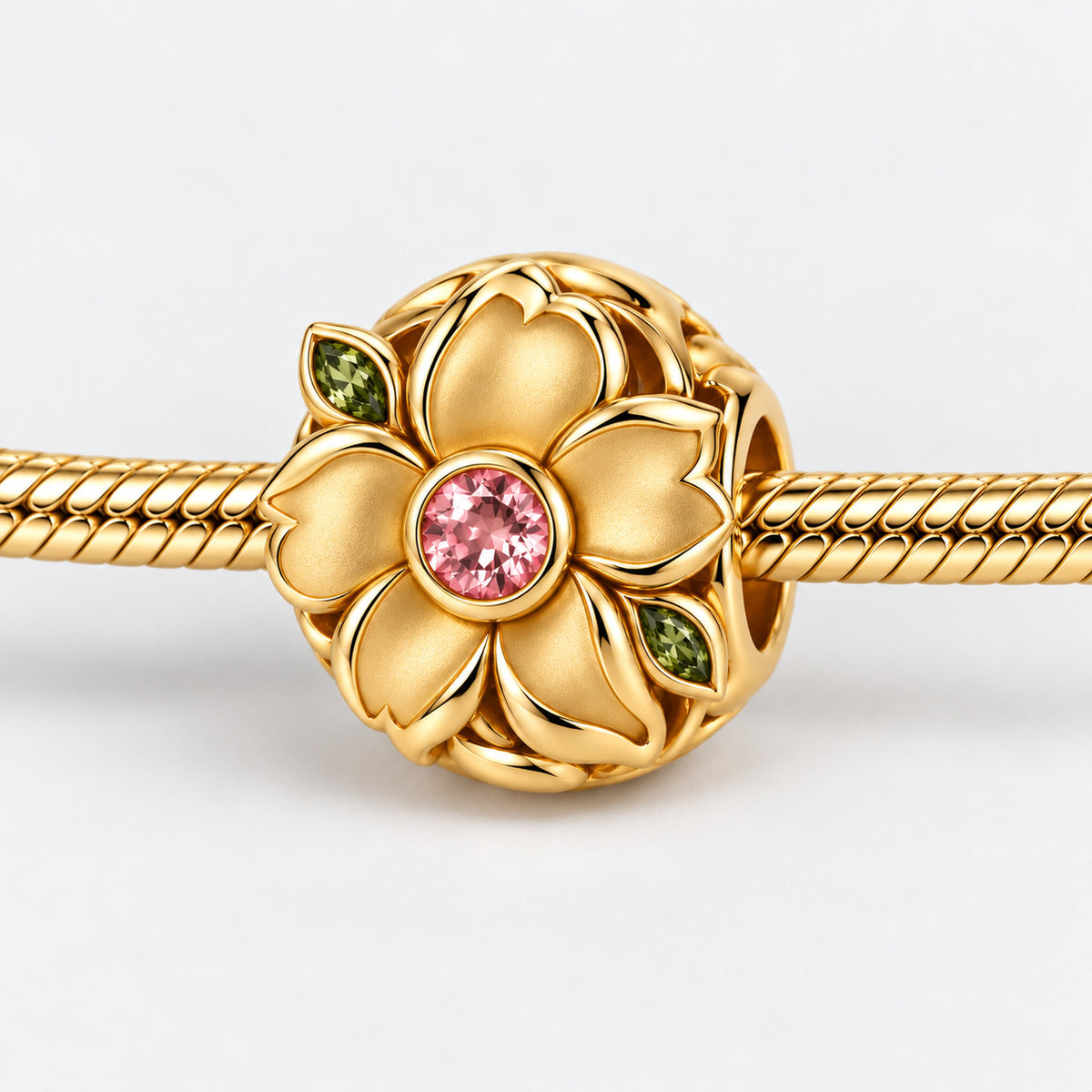 Seed Bloom Bead Charm in gold, on a charm bracelet