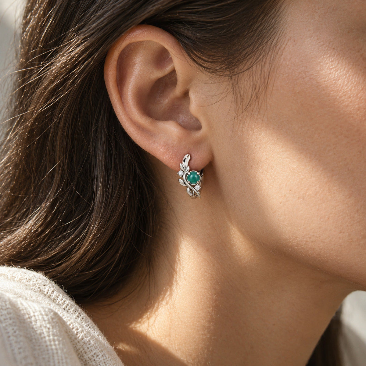 Seed Bloom Earrings in silver, worn