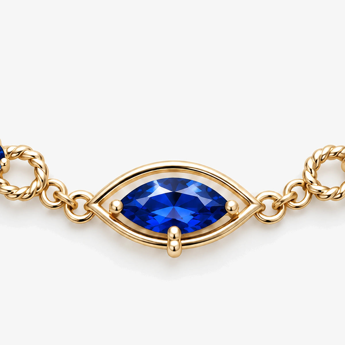 Six Eyes Infinity Necklace in gold, close-up of the centre eye and marquise stone