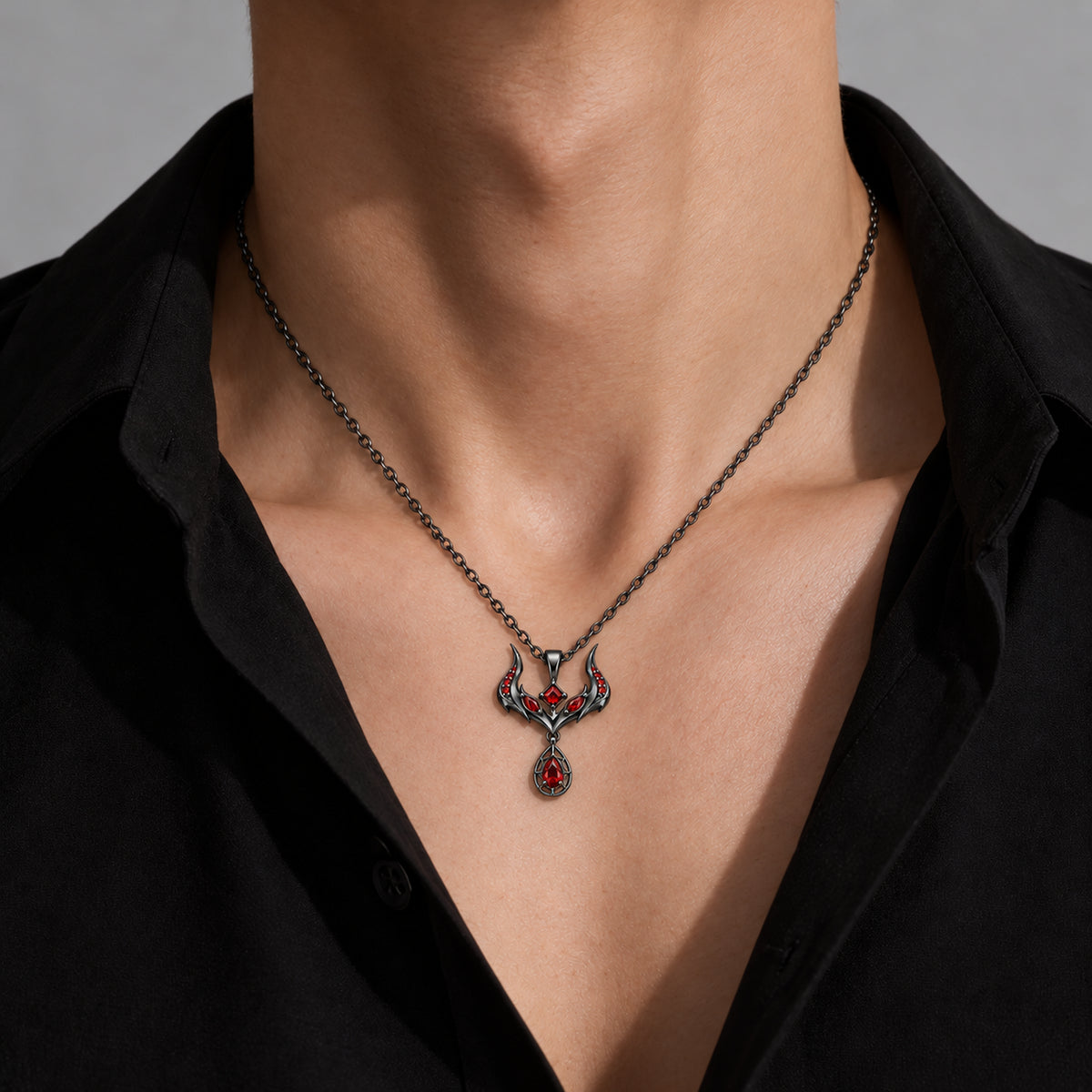 Malevolent Necklace in black color, generated model styling with a black shirt; scale is illustrative