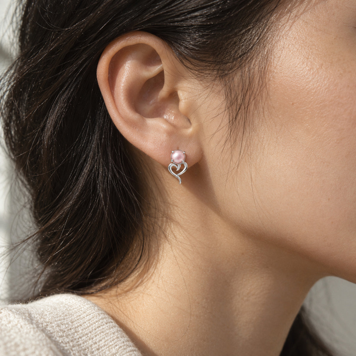Tail Heart Studs in silver, worn