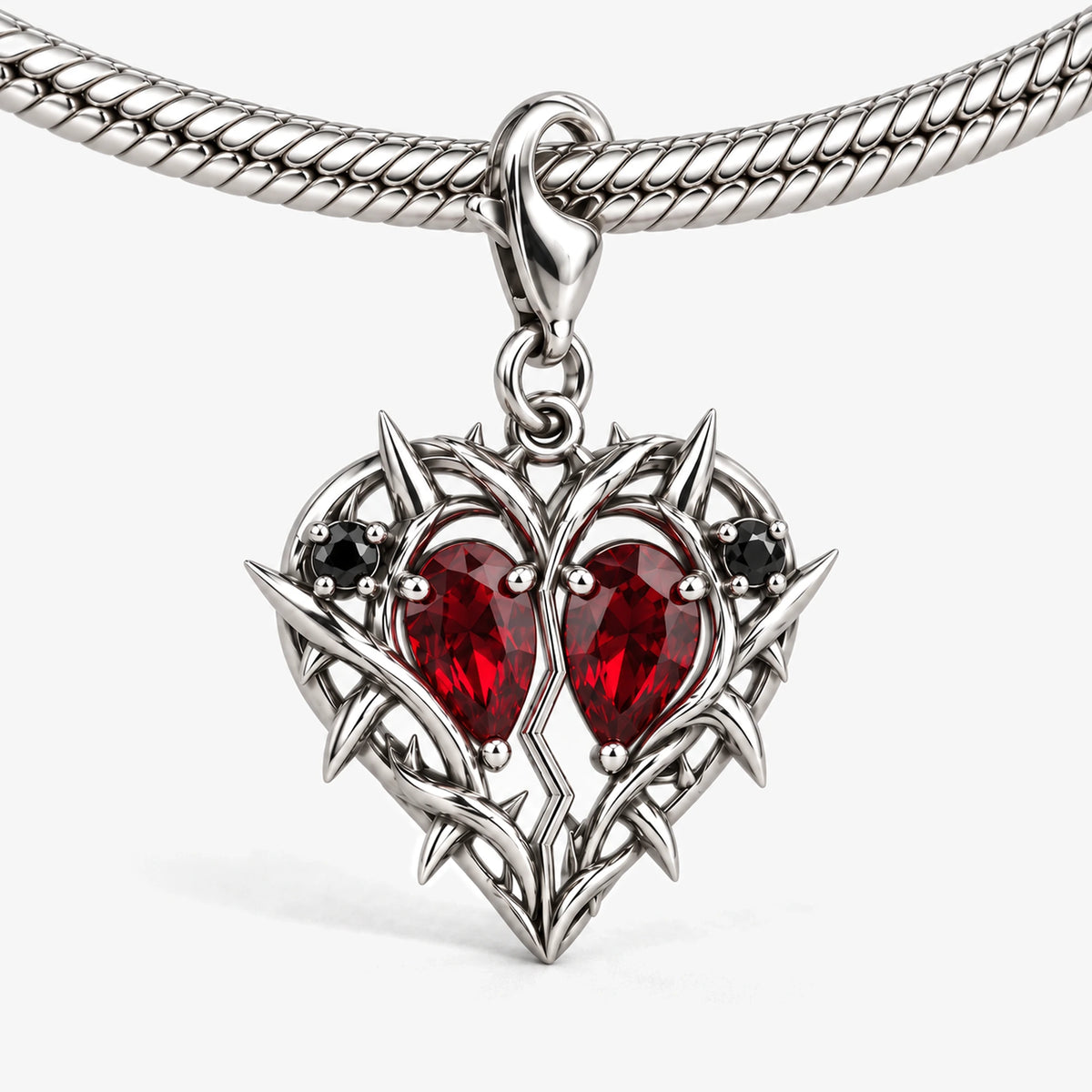 Thorn Princess Heart Charm in Silver, on our silver snake-chain charm bracelet