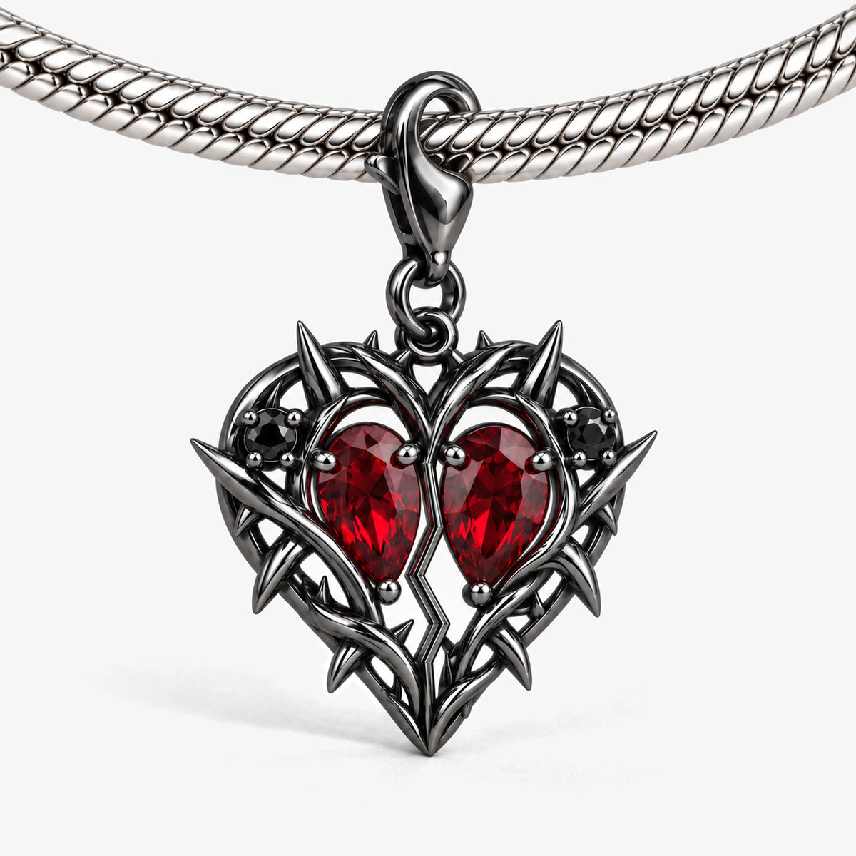 Thorn Princess Heart Charm in Royal Black, on our silver snake-chain charm bracelet