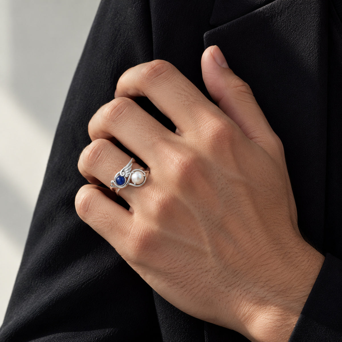 Twin Current Ring in silver, worn on a man's hand