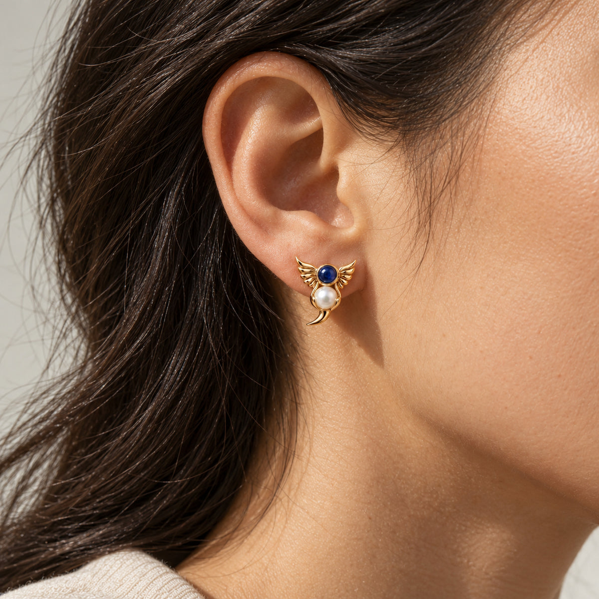 Twin Current Studs in gold, worn
