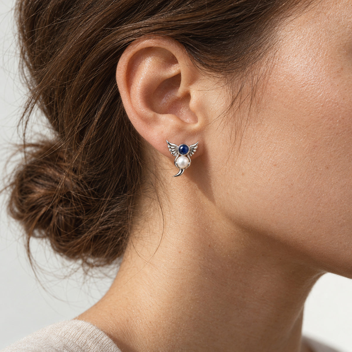 Twin Current Studs in silver, worn