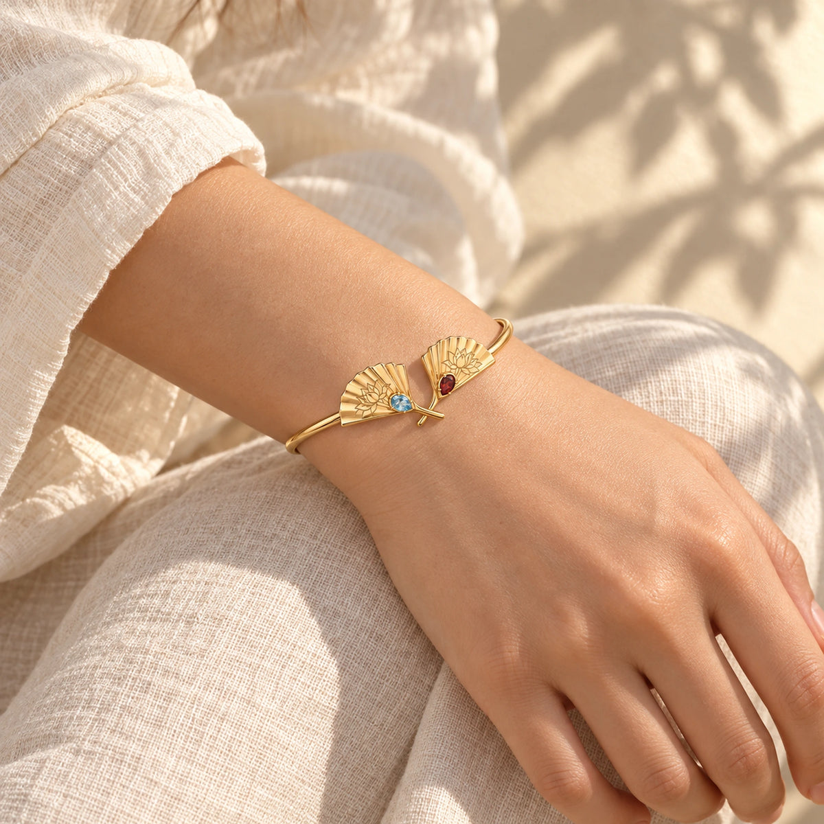 Upper Moon Two Crossed Fans Cuff in gold, worn