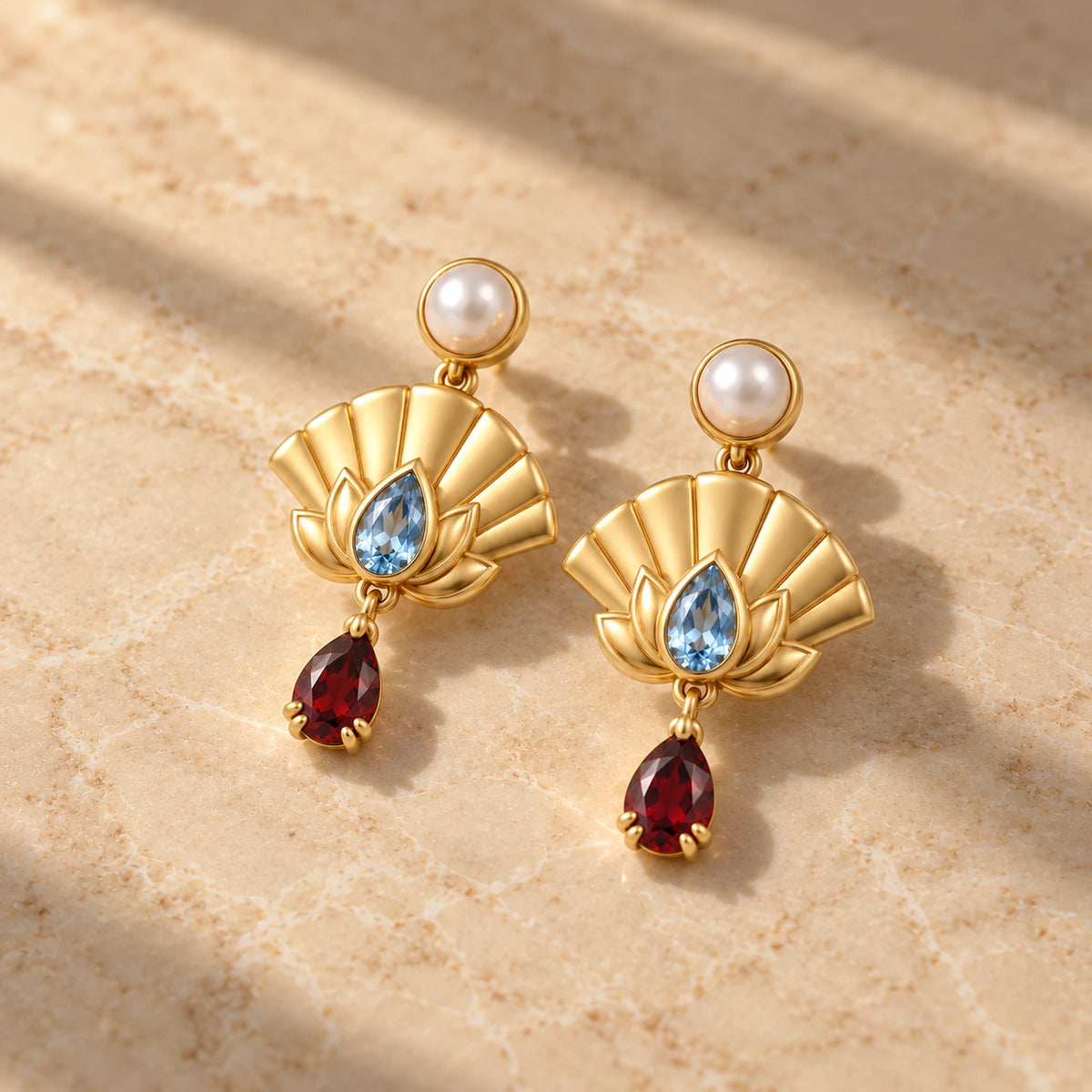 Upper Moon Two Lotus Fan Earrings in gold on marble in window light