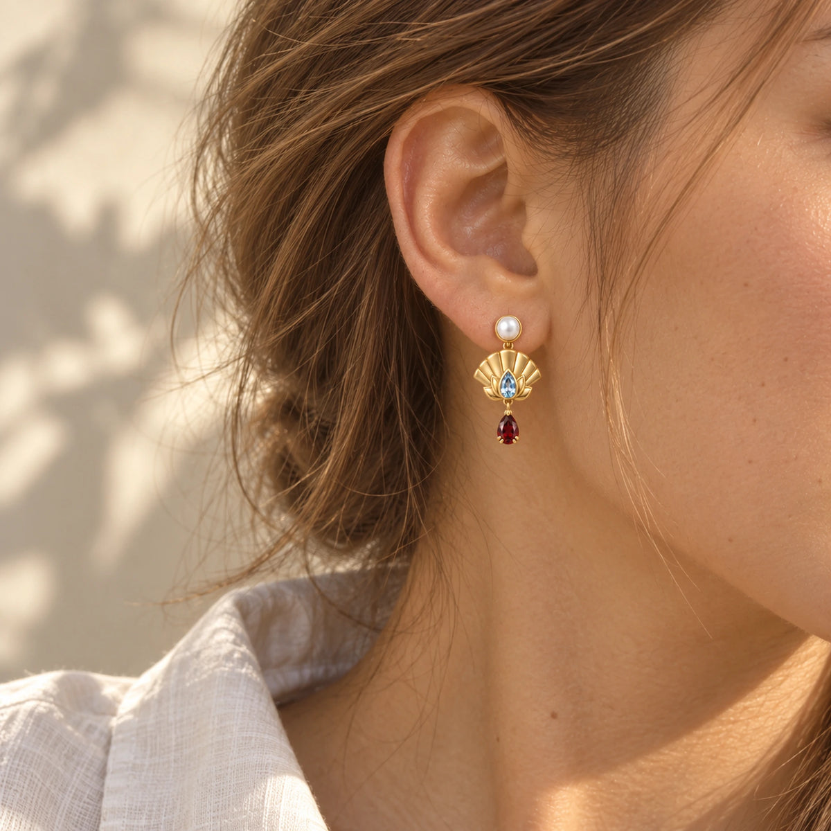 Upper Moon Two Lotus Fan Earrings in gold, worn