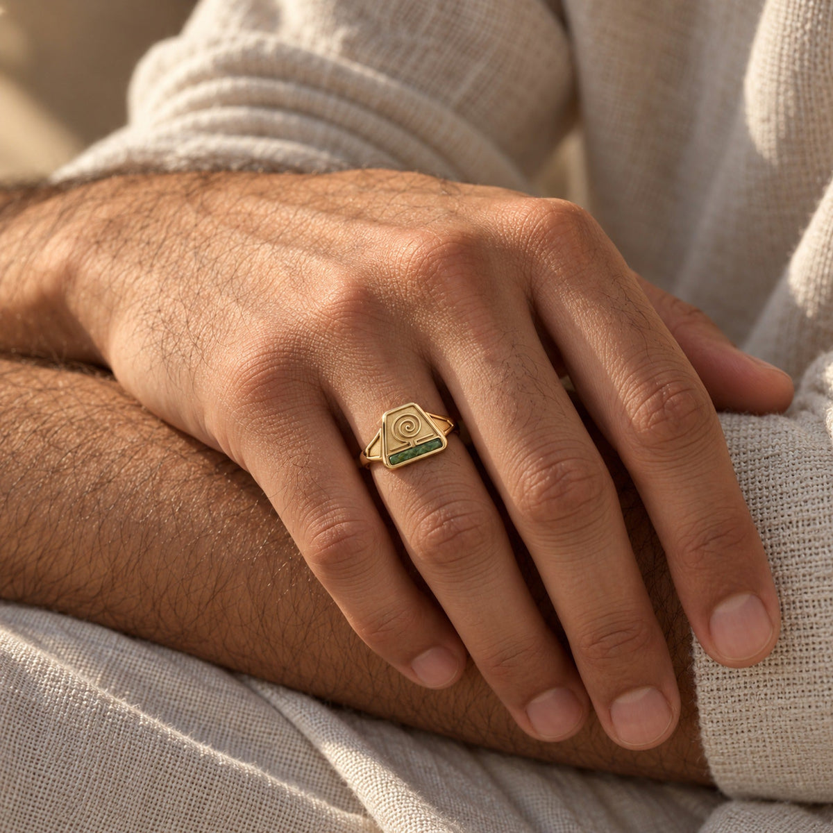 Earth Nation Spiral Ring in gold, worn on a man