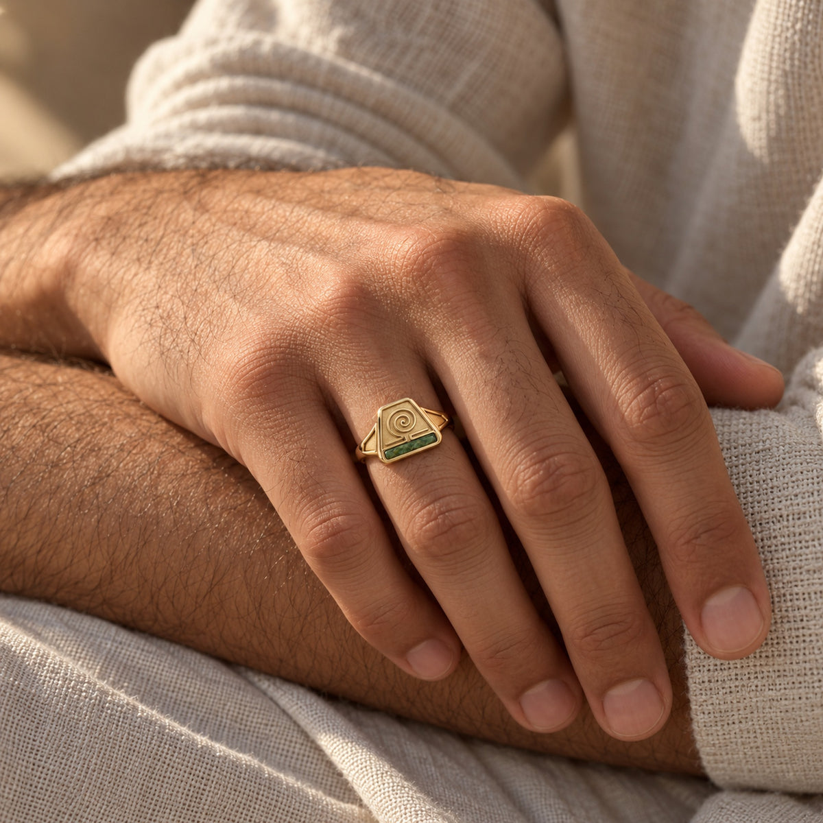 Earth Nation Spiral Ring in gold, worn on a man