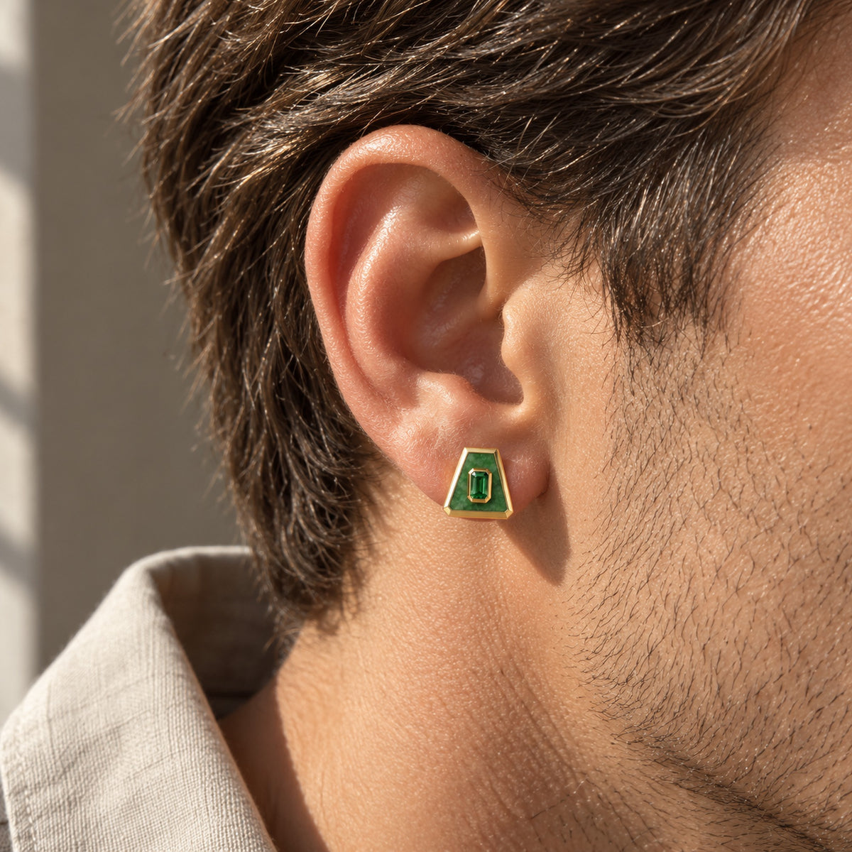 Earth Nation Trapezoid Studs in gold, worn on a man