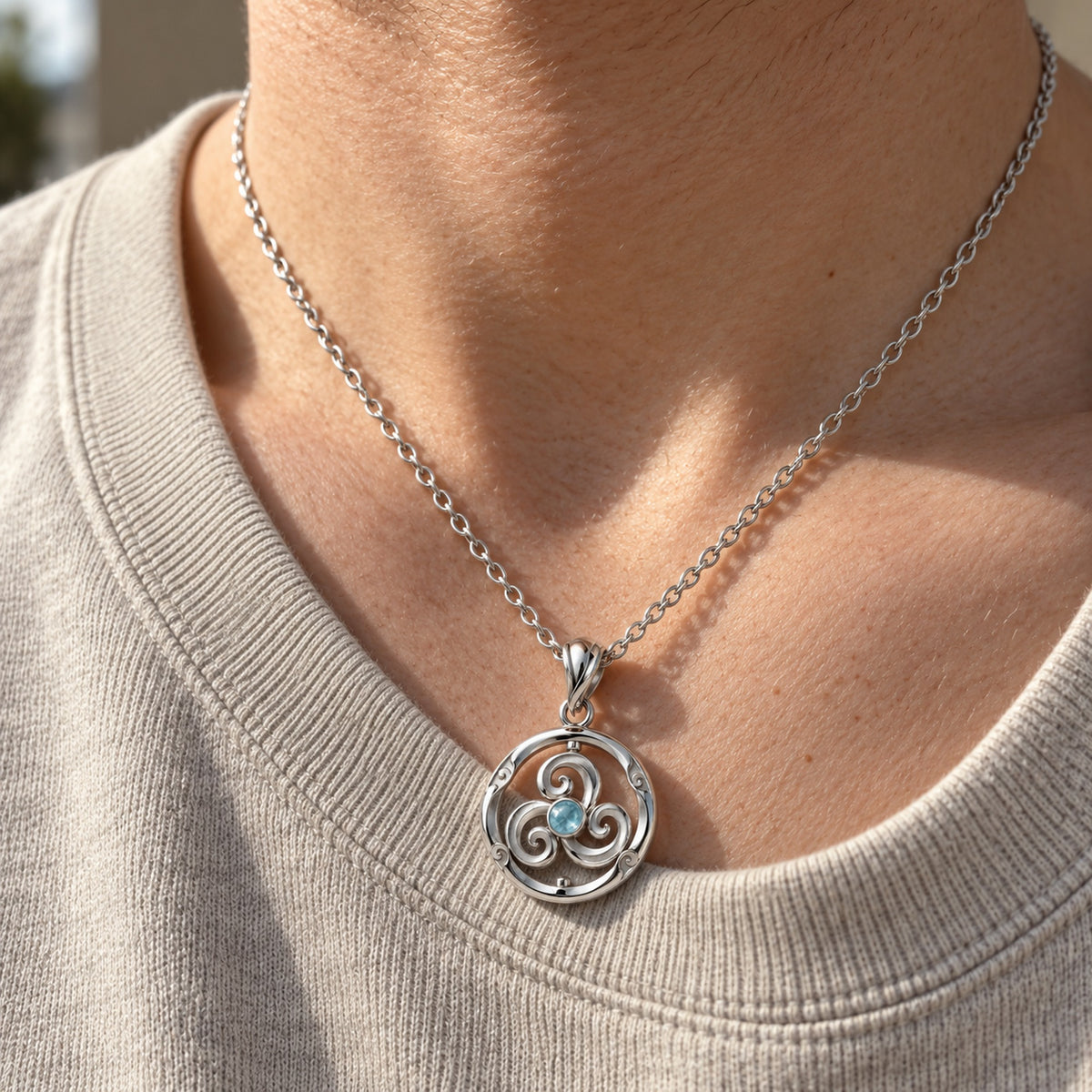 Wind Temple Spinner Necklace in silver, worn on a man