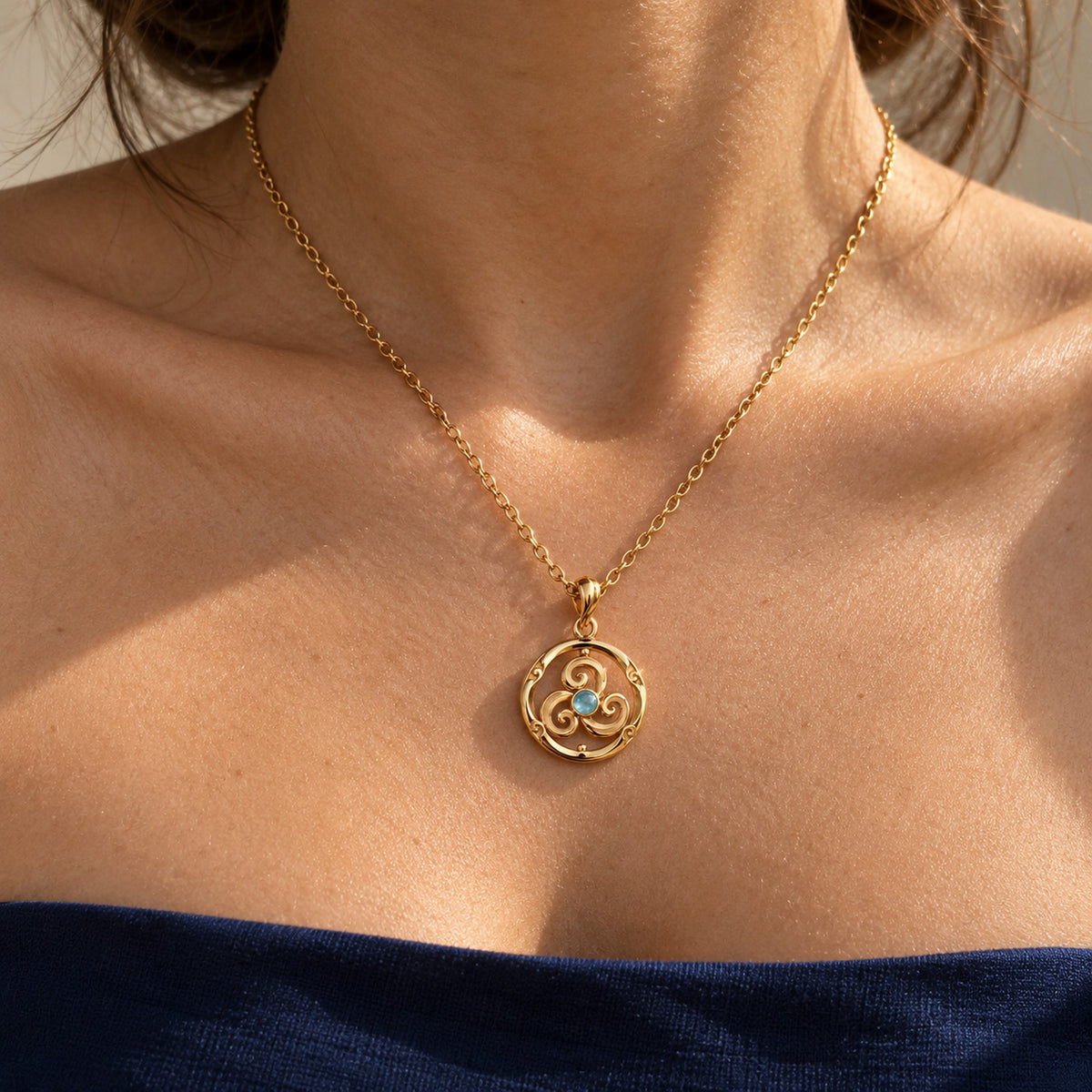 Wind Temple Spinner Necklace in gold, worn
