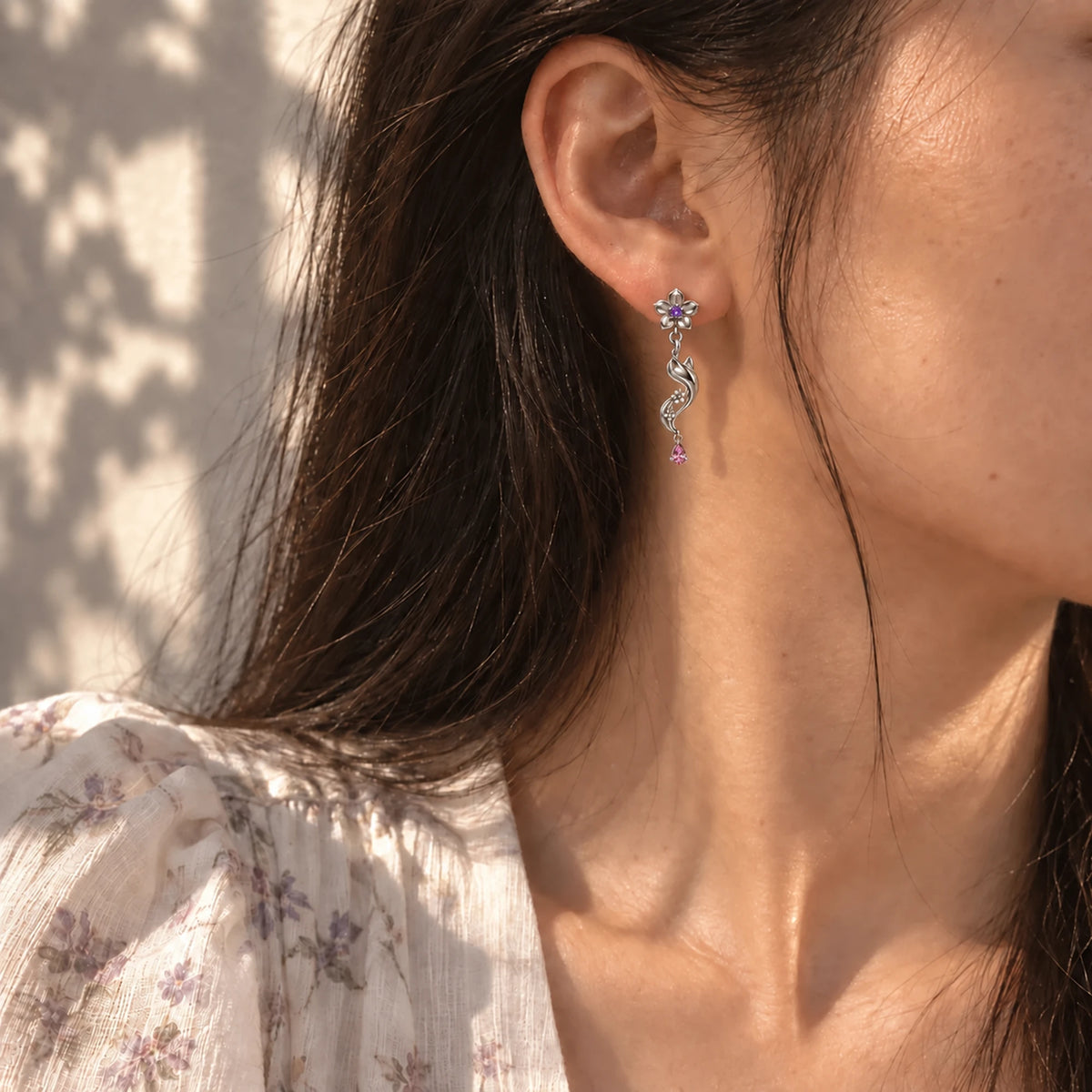 Yae Miko Earrings in silver worn on the ear