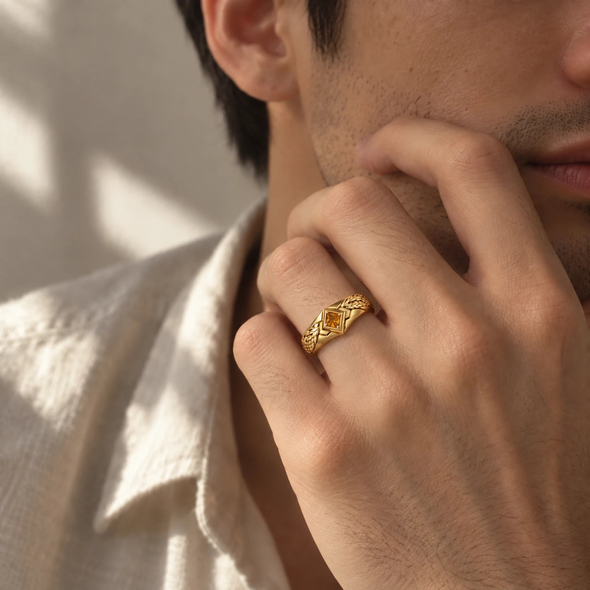 Zhongli Ring in gold worn on a man's hand